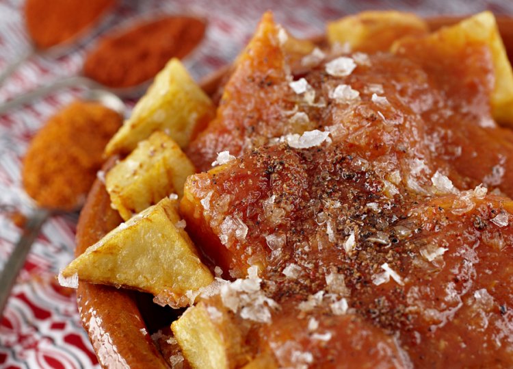 Spicy fried potatoes in tangy tomato sauce