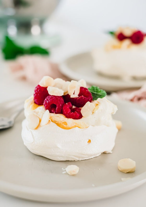 Vanilla bean and mango pavlova with macadamia | Melanie Lionello